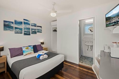 Ένα ή περισσότερα κρεβάτια σε δωμάτιο στο Pacific Motor Inn