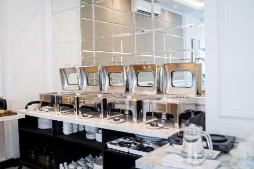 a row of mirrors in a dressing room at The Difan Hotel in Jambi