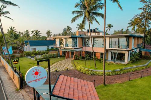 an aerial view of a house with palm trees at ANANSA BOUTIQUE HOTEL by The Kannur Club in Kannur