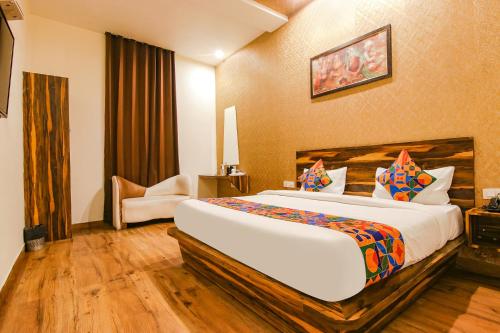 a bedroom with a large bed in a room at FabHotel Sallow Grand in Amritsar