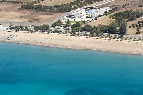 an aerial view of a beach with buildings and the water at Blue Diamond Beach Villas in Paphos City
