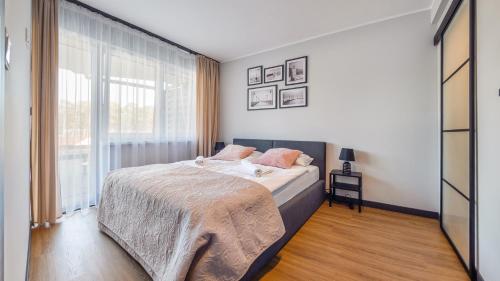 Кровать или кровати в номере Apartamenty Sun & Snow Wypoczynkowa