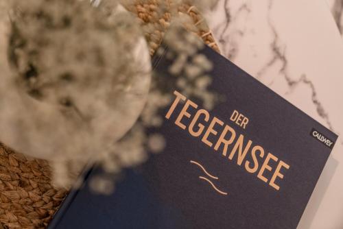a book with the title of the book of teaence at Hotel Villa Lago Garni in Bad Wiessee
