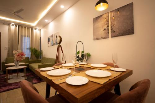 a wooden table in a living room with a dining room at Perfectstayz Value Homes Mussoorie 120 meters uphill in Mussoorie