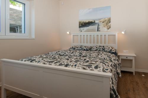 a bedroom with a bed and a window at Villa Sv. Martin in Mali Lošinj