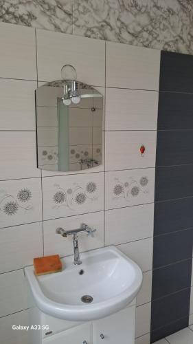 Phòng tắm tại Noclegi , pokoje gościnne
