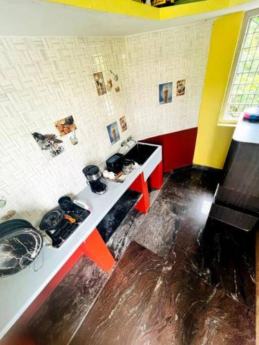 a kitchen with a sink and a counter top at Chamundi_Temple-Hill View. in Mysore