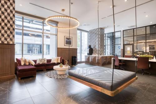 a living room with a couch and a table at Downtown 1BR w Pool Gym nr Staples Center LAX-624 in Los Angeles