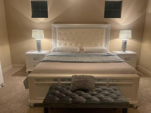 a bedroom with a large bed with two night stands at BAIZA mini castle in the Galleria in Houston