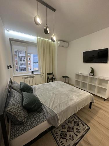 Postel nebo postele na pokoji v ubytování Soborna Apartment