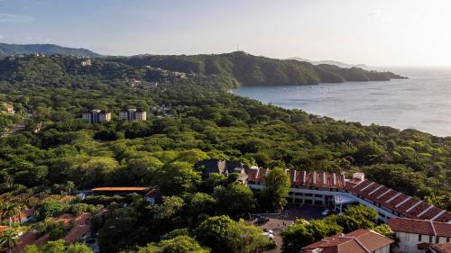 an aerial view of a town next to the water at Villas Sol Beach Resort in Playa Hermosa