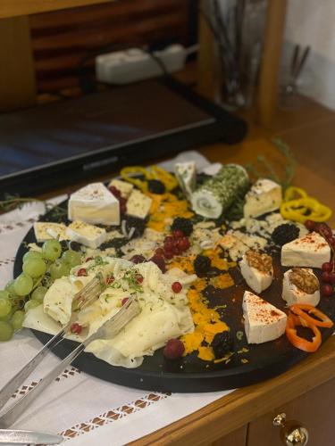 a plate of cheese and other foods on a table at Pension Rucksackpeter in Hohenbrugg an der Raab