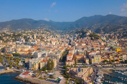 an aerial view of a city next to the water at Seven Suites Apartments - Via Matteotti 178 in Sanremo