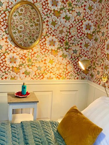 En eller flere senge i et værelse på Hotell St Clemens