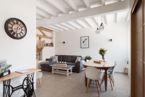 a living room with a couch and a table at La Maison des Délices in Dosches