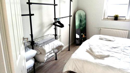 a room with two beds and a surfboard at Der Schwan 8 & 10 - zentral- stilvoll in Düren - Eifel