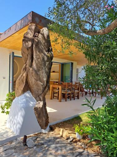a statue of a bear in front of a house at Newly renovated traditional Sardinian dwelling in Porto Rotondo