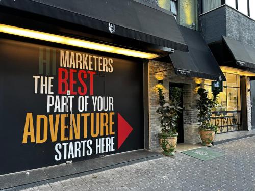 a store window with a sign on the side of it at Levinski Market Hotel in Tel Aviv