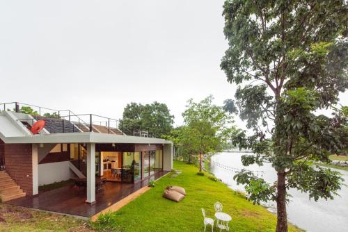 a house with a view of a river at Lake Paradise Villa Khaoyai LB3 in Ban Rai Khlong Sai