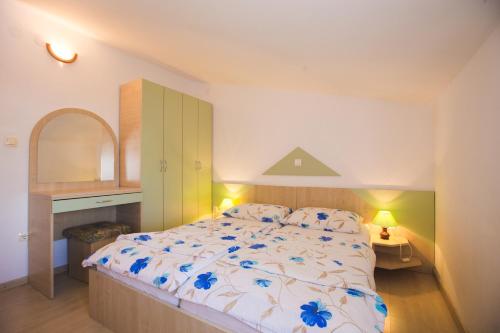 Кровать или кровати в номере Apartmani Nada & Darko, Kampor, Rab, Hrvatska