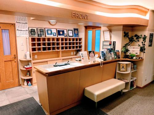 a room with a counter in a store at Business Hotel Ekimae in Hakodate