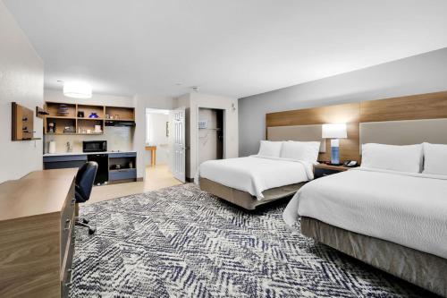 A bed or beds in a room at Candlewood Suites Atlanta West I-20, an IHG Hotel
