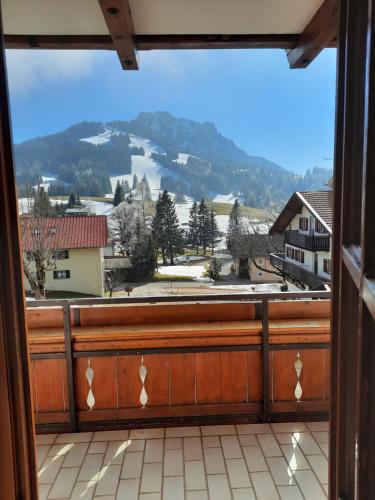 a window with a view of a mountain at Landhaus Müller in Jungholz