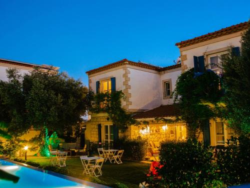 a house with a pool in front of it at AlaNarin Konak in Alaçatı