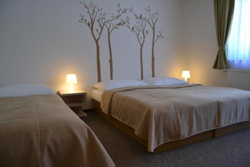 Кровать или кровати в номере Wellness hotel Sauna