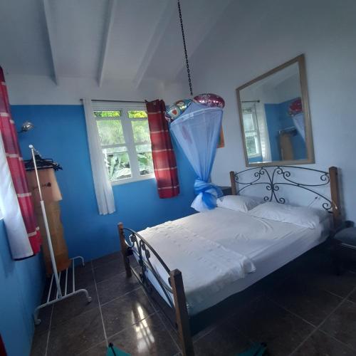 Postel nebo postele na pokoji v ubytování Canefield sea view apartment