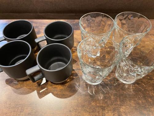 a group of glasses and a vase on a table at Craft ,Town next to Skytree in Tokyo