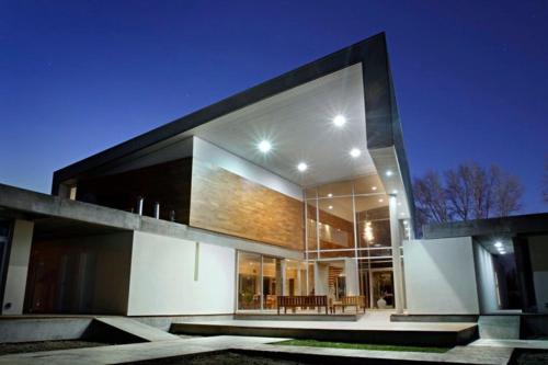 a large building with a table in front of it at Herradura Hotel Suites in Neuquén