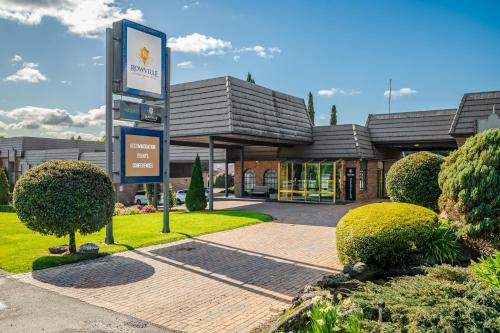 a building with a sign in front of it at Rowville International Hotel in Rowville