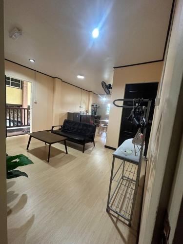 a living room with a couch and a table at Ren-Hana Kundasang in Kundasang