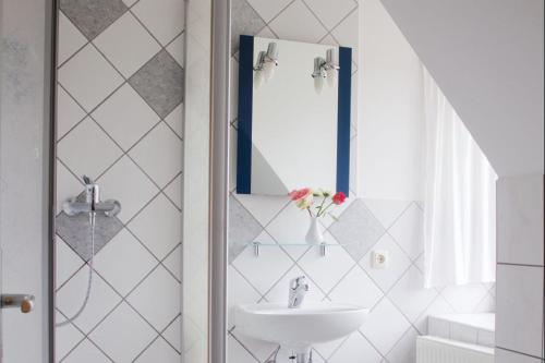 a bathroom with a sink and a mirror at Rittergut Nickelsdorf in Nickelsdorf