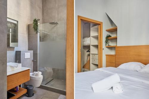 a bedroom with a shower and a bed and a bathroom at Apartment Ile Saint Louis by Studio prestige in Paris