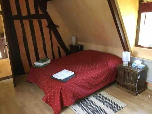 מיטה או מיטות בחדר ב-Chaumière Normandie