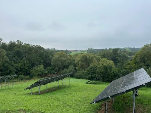 a row of solar panels in a field at Apartament D&D in Gorlice