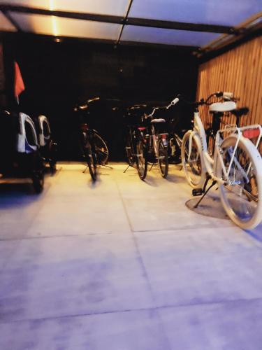 a group of bikes parked in a garage at Apartamenty i Pokoje Złote Piaski in Jastrzębia Góra