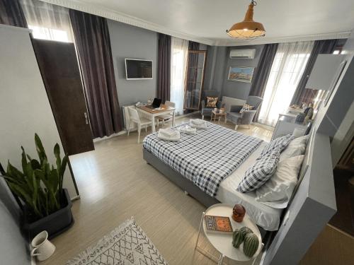 a bedroom with a bed and a living room at Flats Company - Karakoy Apartment in Istanbul