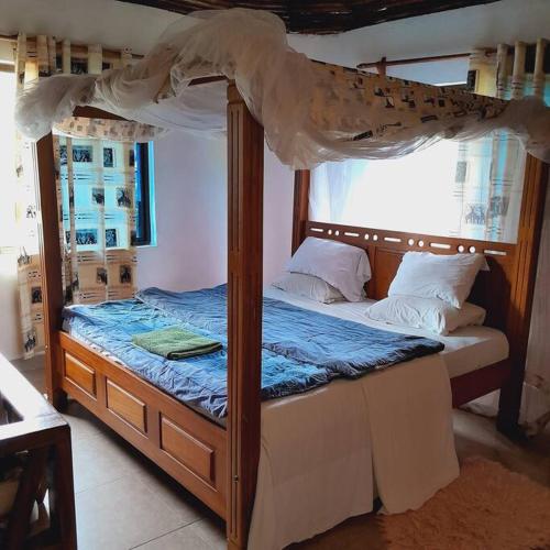 Postelja oz. postelje v sobi nastanitve Manuastro Breeze Villa - Diani Beach