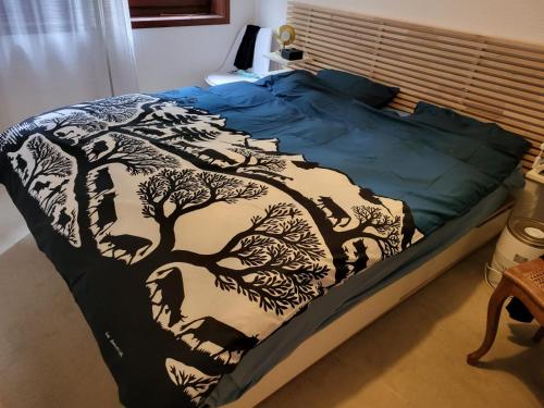 Ένα ή περισσότερα κρεβάτια σε δωμάτιο στο Au calme du Jura