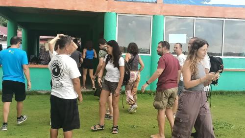 a group of people standing outside of a building at Aloha Guest House Nias in Hilibotodane