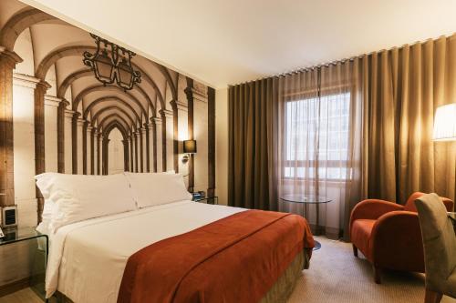 Postel nebo postele na pokoji v ubytování Hotel Marques De Pombal