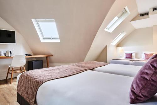 Katil atau katil-katil dalam bilik di Hotel Magenta 38 by Happyculture