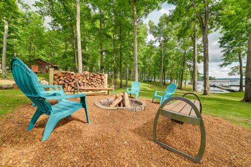a group of chairs sitting around a fire pit at Cozy Dover Home with Boat Dock, Fire Pit and Deck! in Dover