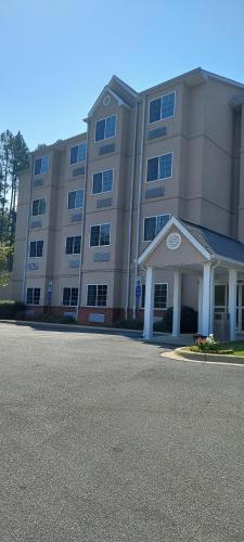 a large apartment building with a street in front of it at Microtel Inn & Suites by Wyndham Hoover/Birmingham in Hoover