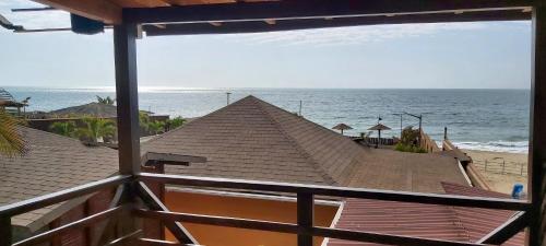 a view of the ocean from a balcony of a beach at Guille Bungalows in Canoas De Punta Sal