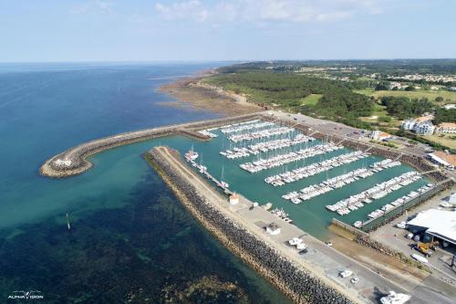 an aerial view of a marina with boats in the water at L'Essentiel - Love 5 Etoiles in Talmont