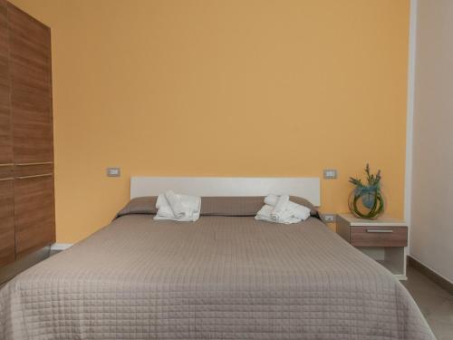 a bedroom with a bed with two towels on it at Residence Art in Rimini
